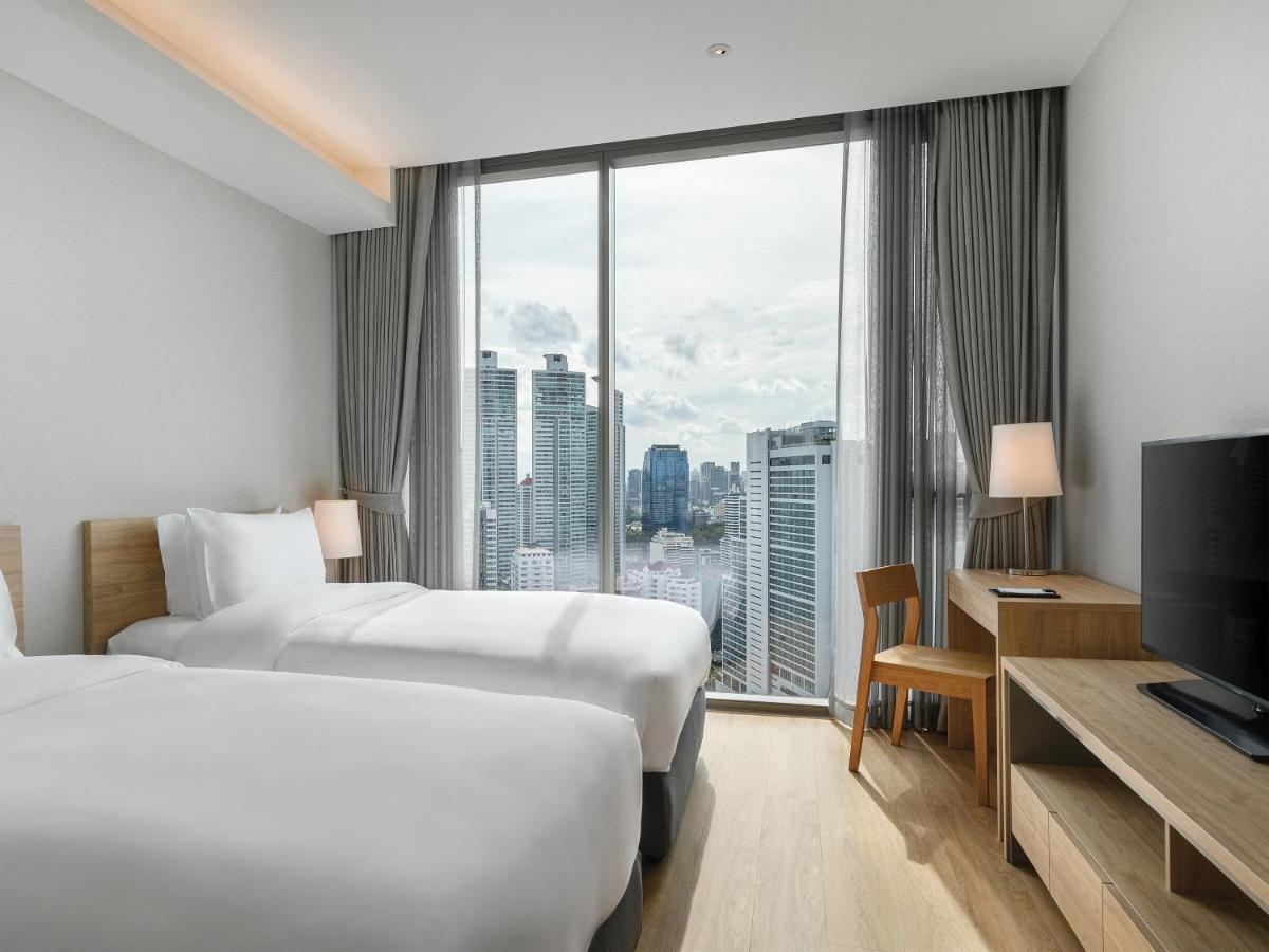 Oakwood Suites Bangkok Kültér fotó Deluxe Room