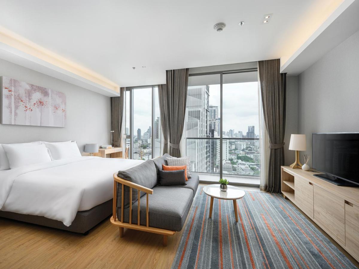 Oakwood Suites Bangkok Kültér fotó Deluxe Room