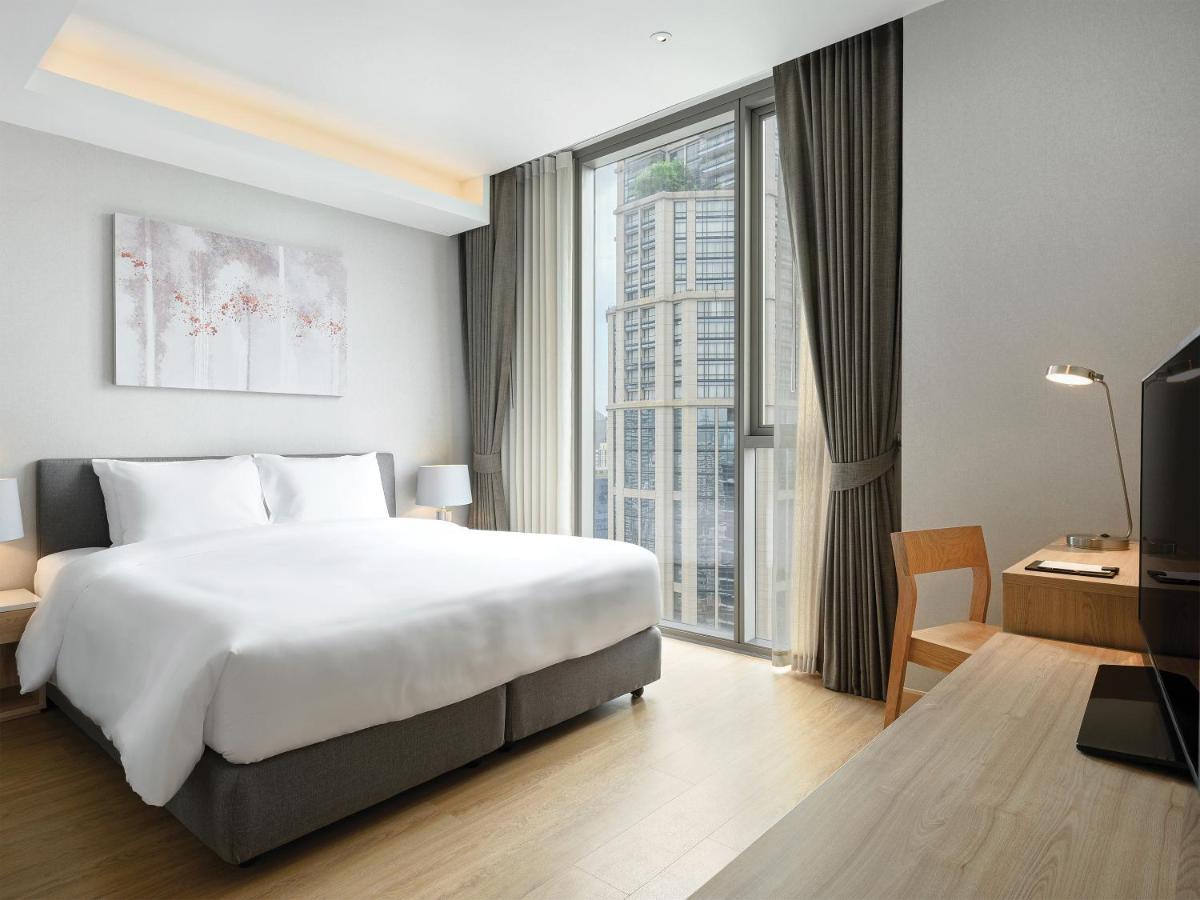 Oakwood Suites Bangkok Kültér fotó Deluxe Room
