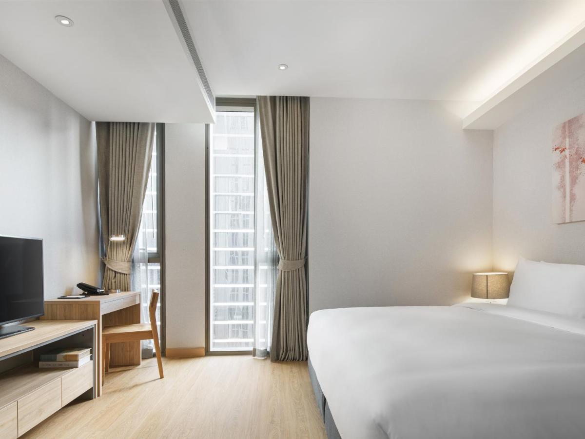 Oakwood Suites Bangkok Kültér fotó Deluxe Room