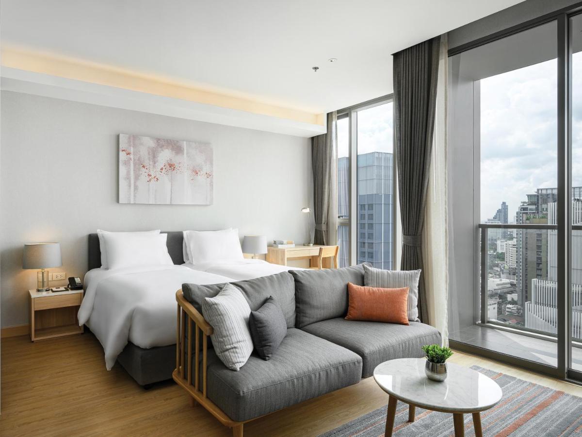 Oakwood Suites Bangkok Kültér fotó Deluxe Room