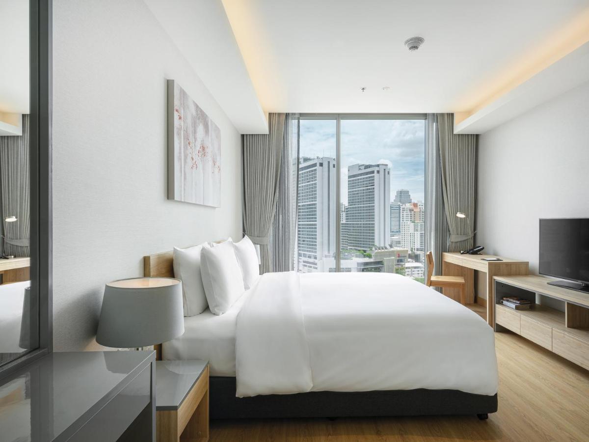 Oakwood Suites Bangkok Kültér fotó Bedroom