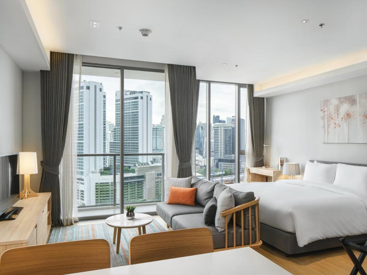Oakwood Suites Bangkok Kültér fotó Deluxe Room