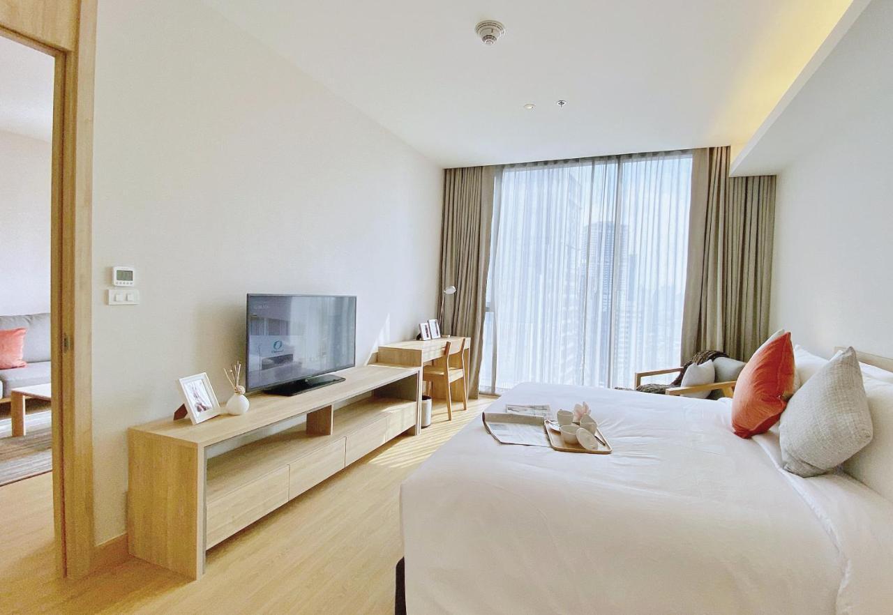 Oakwood Suites Bangkok Kültér fotó Deluxe Room