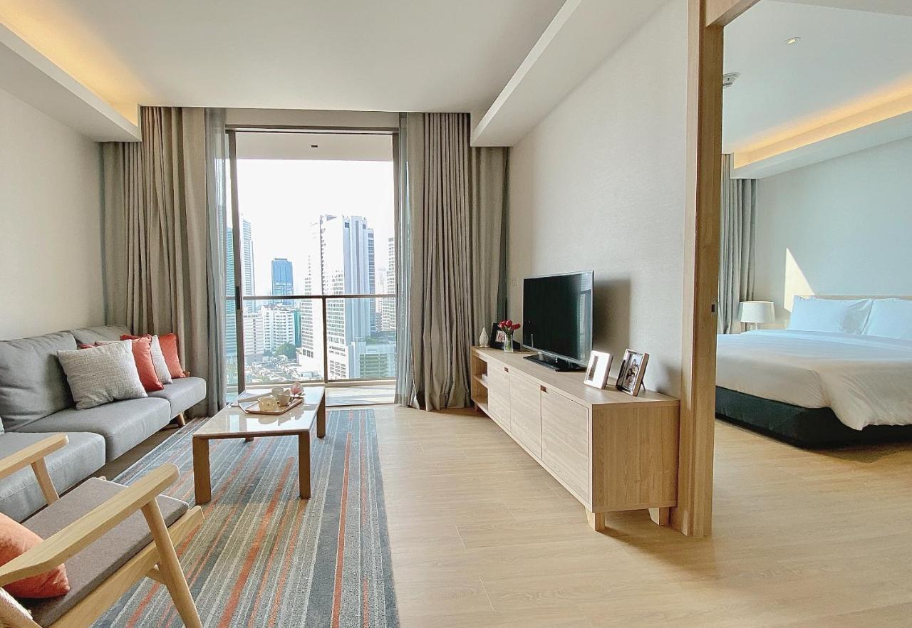 Oakwood Suites Bangkok Kültér fotó A typical one-bedroom apartment
